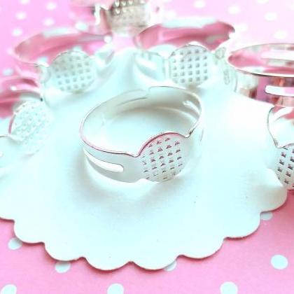 30 White Bright Silver Tone Ring Blanks With Glue..